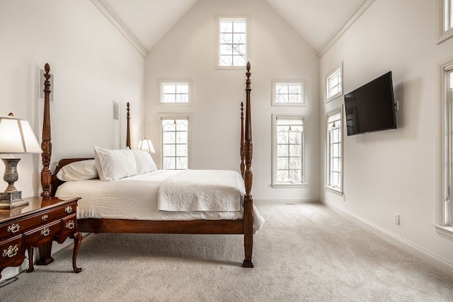 bedroom with crown molding, high vaulted ceiling, and light colored carpet