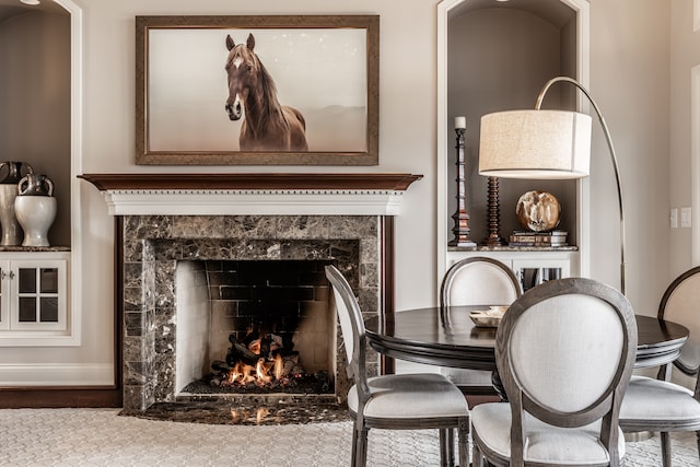 living area with a high end fireplace