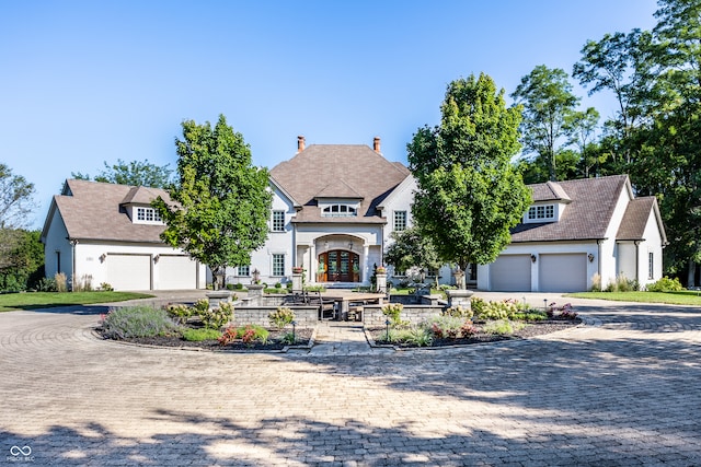 view of front facade with french doors and a garage