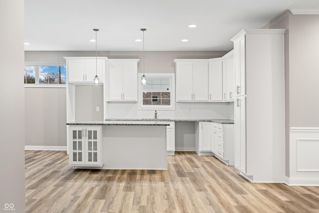 3368 Johns Way, Greenwood, IN 46143 - kitchen featuring light wood-style flooring, recessed lighting, backsplash, stone countertops, and white cabinetry