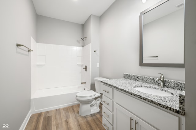 full bathroom featuring hardwood / wood-style flooring, vanity, toilet, and shower / washtub combination