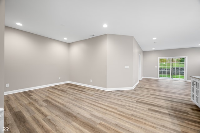 spare room with light wood-type flooring