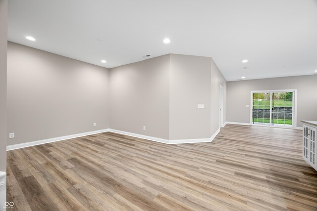 3368 Johns Way, Greenwood, IN 46143 - unfurnished living room with light wood-style flooring, baseboards, and recessed lighting