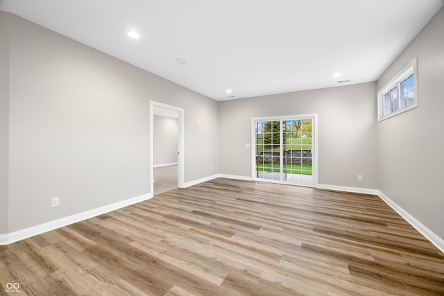 unfurnished room with light hardwood / wood-style floors