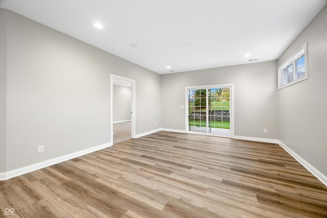 3368 Johns Way, Greenwood, IN 46143 - spare room featuring plenty of natural light, wood finished floors, recessed lighting, and baseboards