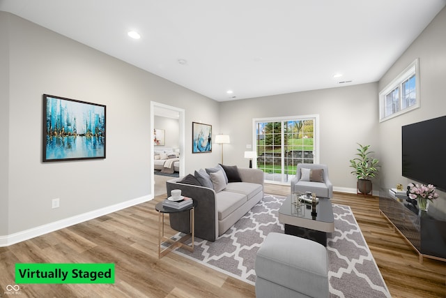 living room with light hardwood / wood-style flooring