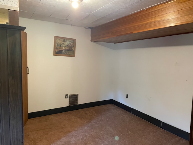 basement with dark carpet