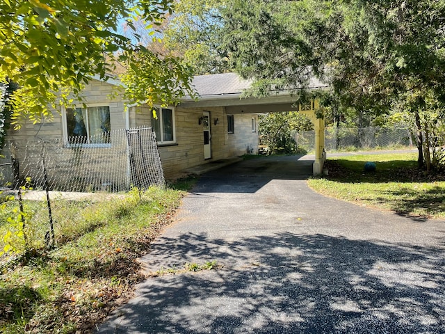 view of front of house featuring a carport