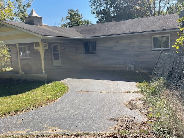 view of side of property featuring a porch