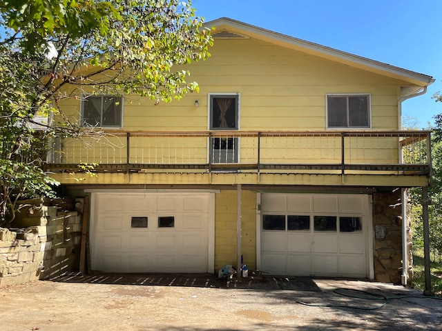 exterior space featuring central AC and a garage