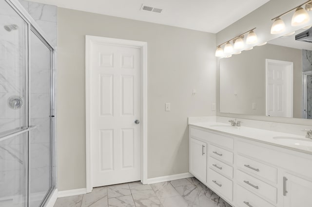 bathroom with dual sinks, tile flooring, an enclosed shower, and vanity with extensive cabinet space