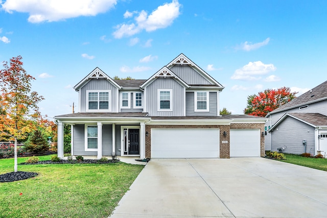 craftsman-style house featuring a front lawn and a garage