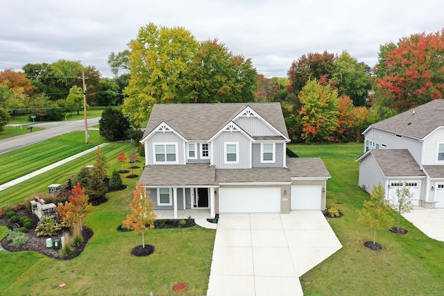 view of front facade featuring a front lawn and a garage