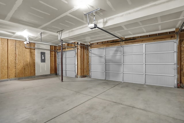 garage featuring wood walls