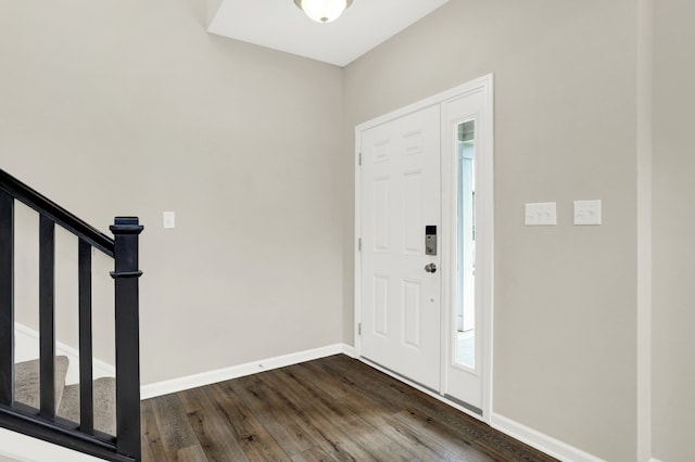 foyer entrance featuring dark hardwood / wood-style floors