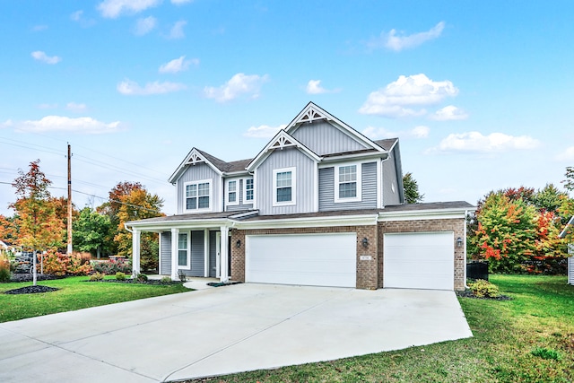 view of front of house with a front lawn and a garage