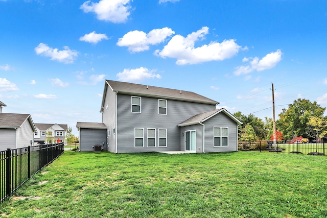 back of property featuring a patio area and a lawn