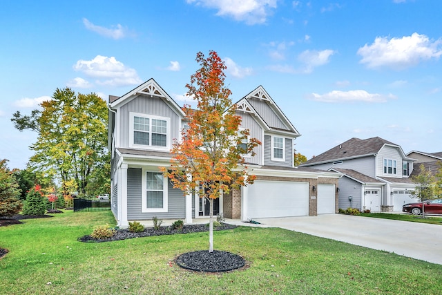 craftsman inspired home featuring a front yard and a garage