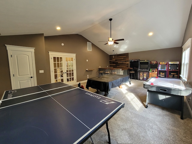 playroom with french doors, ceiling fan, carpet flooring, and lofted ceiling