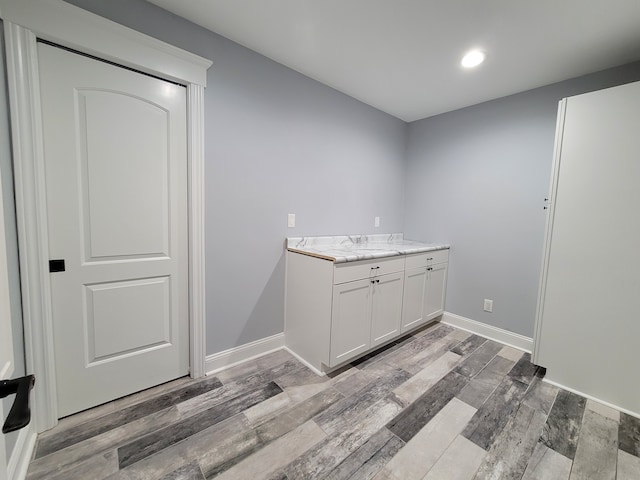 bathroom featuring vanity and hardwood / wood-style floors