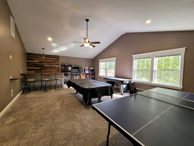 playroom featuring carpet flooring, pool table, ceiling fan, bar, and vaulted ceiling