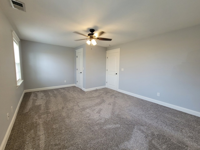 empty room featuring carpet flooring and ceiling fan