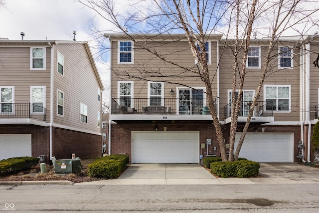 view of front of property featuring brick siding, central AC unit, an attached garage, and concrete driveway