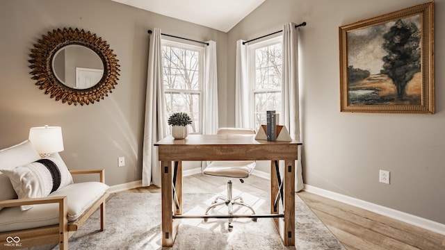 home office with vaulted ceiling, wood finished floors, and baseboards