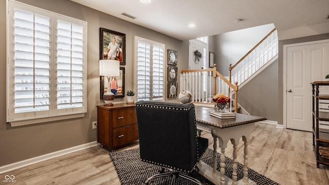 office area with visible vents, recessed lighting, light wood-style floors, and baseboards