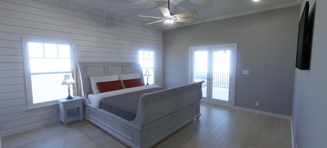 bedroom featuring access to exterior, ceiling fan, and light wood-type flooring