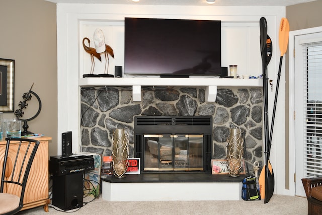 room details with a fireplace and carpet