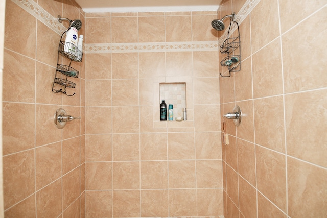 bathroom with a tile shower