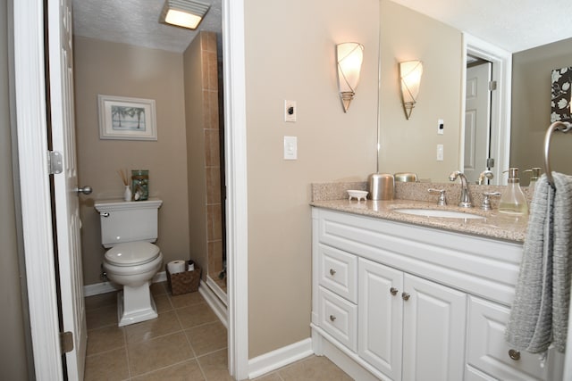 bathroom with walk in shower, a textured ceiling, toilet, vanity, and tile patterned floors