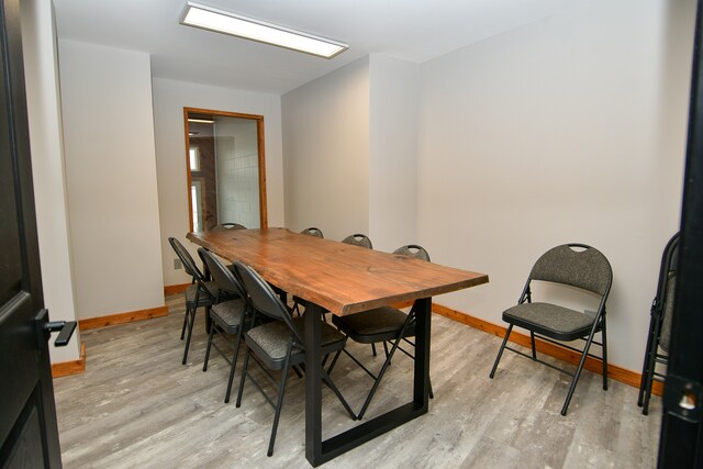 dining area featuring light wood-type flooring