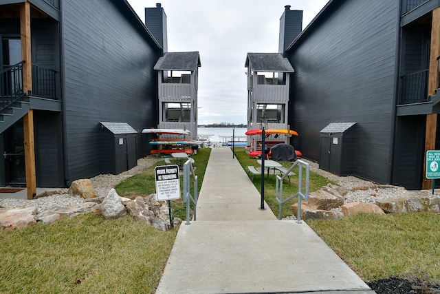 surrounding community featuring a water view