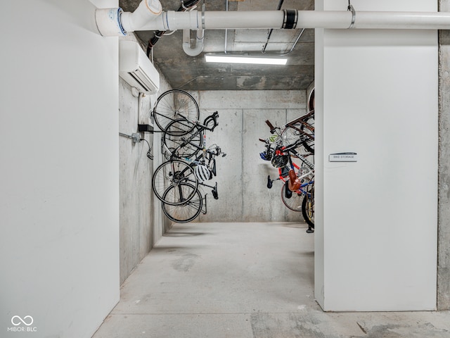 garage featuring a wall unit AC