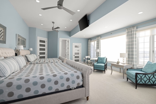 bedroom featuring recessed lighting, multiple windows, and light carpet