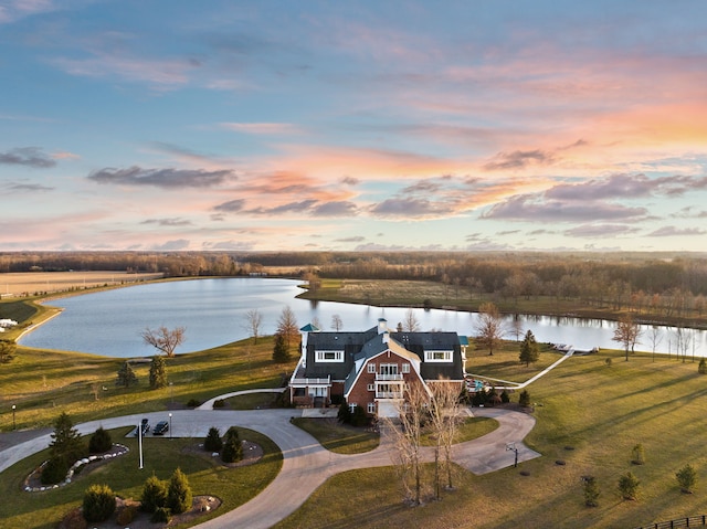 aerial view at dusk with a water view