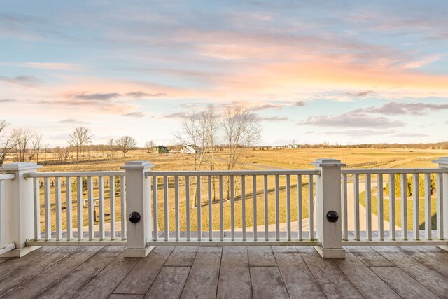 wooden deck featuring a rural view