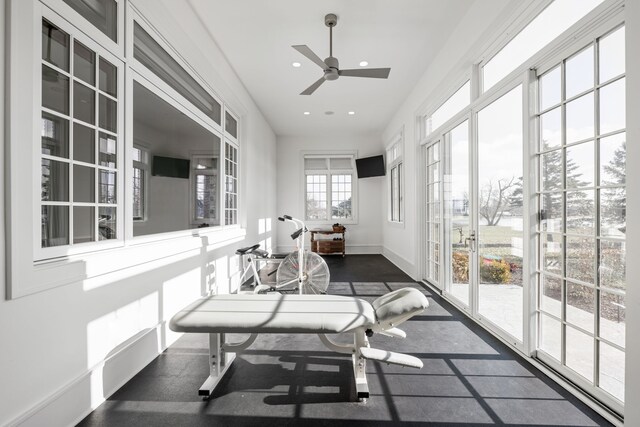 sunroom with a ceiling fan