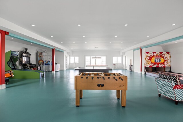 playroom featuring concrete flooring and recessed lighting