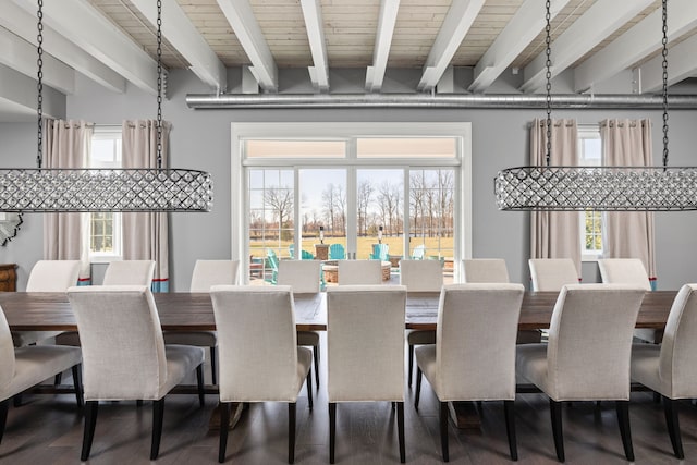 dining space featuring beamed ceiling, plenty of natural light, and wooden ceiling