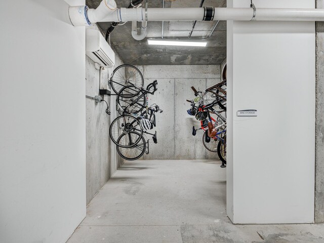 garage featuring an AC wall unit