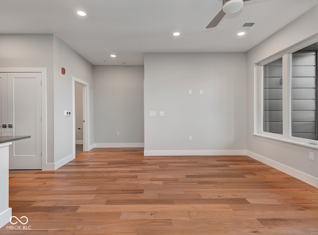 spare room with ceiling fan and light hardwood / wood-style flooring