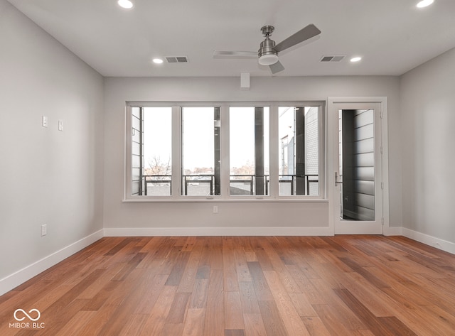 spare room featuring ceiling fan and light hardwood / wood-style flooring