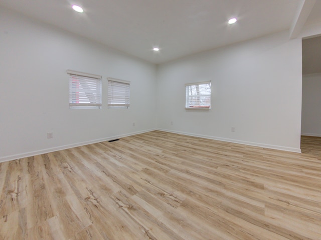 empty room with light hardwood / wood-style floors