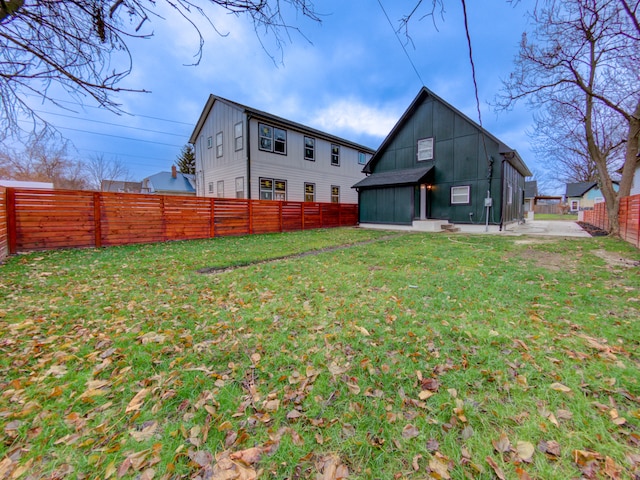 back of property featuring a lawn