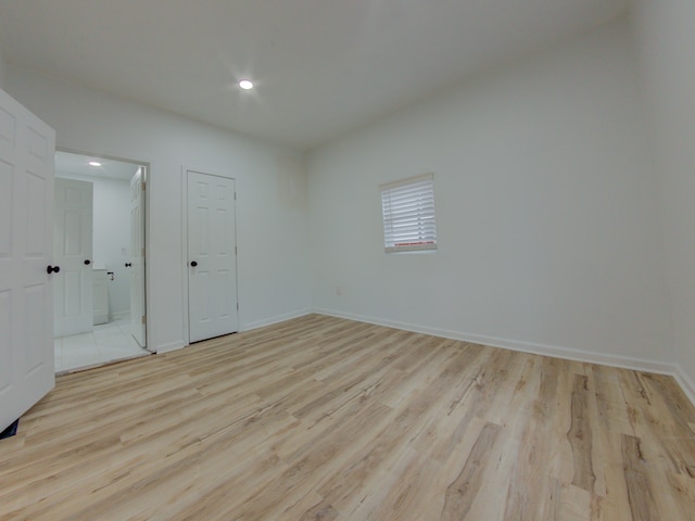 unfurnished bedroom with light hardwood / wood-style flooring