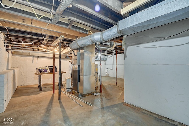 unfinished basement with heating unit