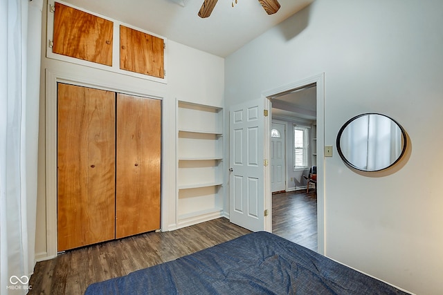 unfurnished bedroom with ceiling fan, a closet, and wood finished floors